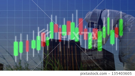 Inspecting gloved beekeeper checking hives in field, with candlestick bars, gridlines, copy space 135403605