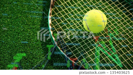 Tennis racket and tennis ball lying on turf court showing financial chart overlay, copy space 135403625