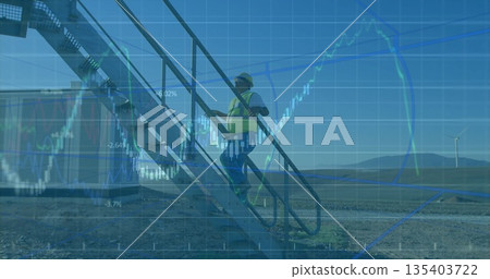 Ascending engineer wearing vest and hat on metal staircase with wind turbines, financial charts 135403722