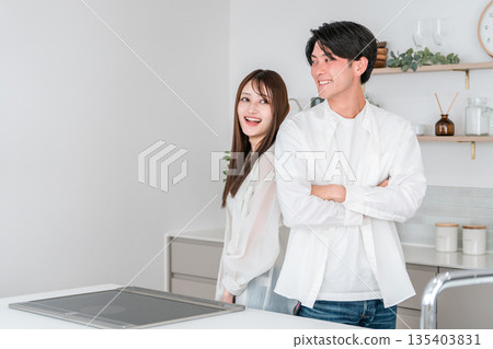 Couples, lovers, and partners lined up in the kitchen and dining room of their own home Couples, lovers, and partners lined up in the kitchen and dining room of their own home 135403831