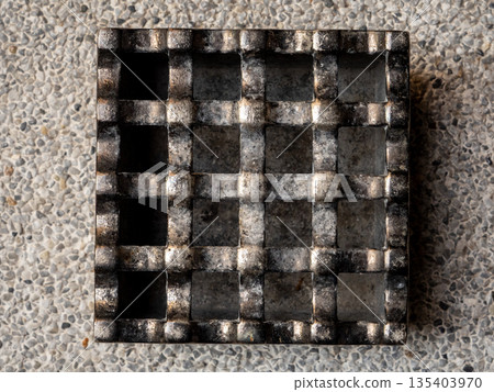 A cast metal box is used as an ashtray A cast metal box is used as an ashtray 135403970