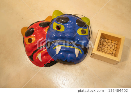 Setsubun demon mask and beans in a wooden box Setsubun demon mask and beans in a wooden box 135404402