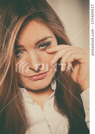Sad woman cry alone and touch face. 135404817