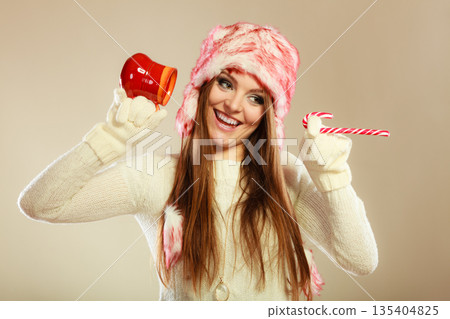 Girl playing with cane and mug. Girl playing with cane and mug. 135404825
