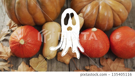 Ghost image over pumpkins and autumn leaves on wooden surface Ghost image over pumpkins and autumn leaves on wooden surface 135405116