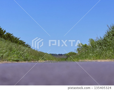 Road and blue sky in the Japanese suburbs Road and blue sky in the Japanese suburbs 135405324