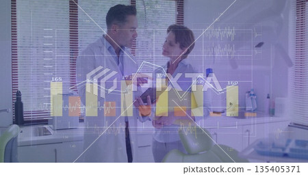Reviewing tablet, dentist and colleague in lab coat and blouse in dental clinic, with green chair Reviewing tablet, dentist and colleague in lab coat and blouse in dental clinic, with green chair 135405371