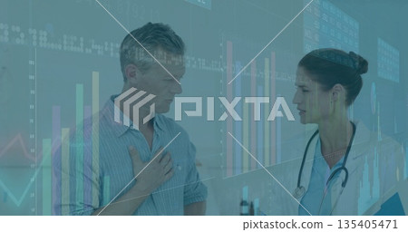 Patient holding chest while consulting doctor in clinic with stethoscope and charts, copy space 135405471