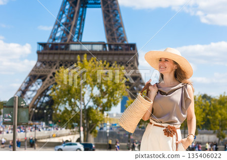 Confident Traveler Posing with Straw Bag in Paris 135406022