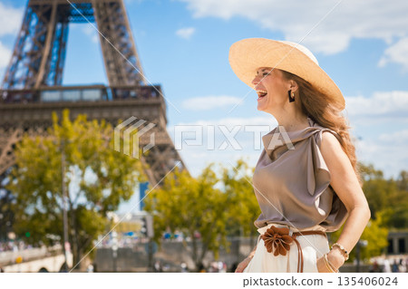 Radiant Parisian Joy in Front of Eiffel Tower 135406024