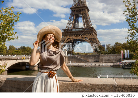Blissful Woman Embracing Parisian Sunshine Blissful Woman Embracing Parisian Sunshine 135406030