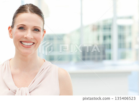 Female professional standing before window at office wearing blouse, city view backdrop, copy space Female professional standing before window at office wearing blouse, city view backdrop, copy space 135406523