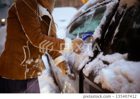 Scraping Side Window Ice - Winter Car Maintenance 135407412