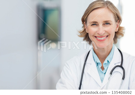 Female doctor smiling and holding stethoscope in bright clinic with diagnostic monitor, copy space 135408002