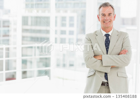 Middle-aged man standing at windows on terrace holding railing, wearing jacket and tie, copy space Middle-aged man standing at windows on terrace holding railing, wearing jacket and tie, copy space 135408188