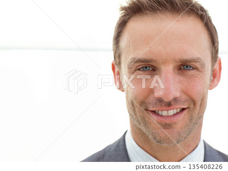 Mid adult male wearing grey suit jacket, striped shirt looking at camera in studio, copy space 135408226