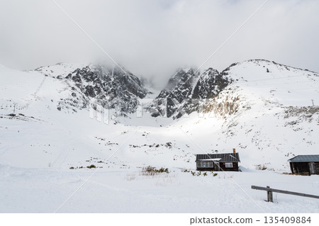 Wooden house near the Lomnicky Peak mountain, Slovakia, High Tatras region. Wooden house near the Lomnicky Peak mountain, Slovakia, High Tatras region. 135409884