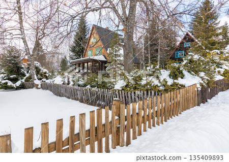 Small houses covered with snow in winter at Slovakia High Tatras mountains. Winter weather. 135409893