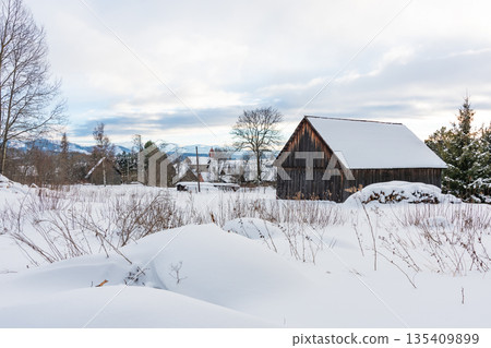 Small houses covered with snow in winter at Slovakia High Tatras mountains. Winter weather. 135409899