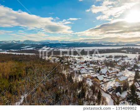 Aerial drone landscape view of Low Tatras mountains (Nizke Tatry). Winter cold weather, blue sky. Aerial drone landscape view of Low Tatras mountains (Nizke Tatry). Winter cold weather, blue sky. 135409902