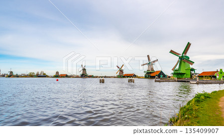 Traditional windmills over at the Zaanse Schans, cloudy weather Traditional windmills over at the Zaanse Schans, cloudy weather 135409907