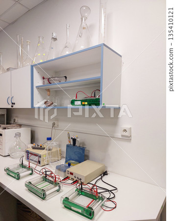 Biology laboratory workspace with electronic equipment and experimental setup used for scientific research, education and academic laboratory work Biology laboratory workspace with electronic equipment and experimental setup used for scientific research, education and academic laboratory work 135410121