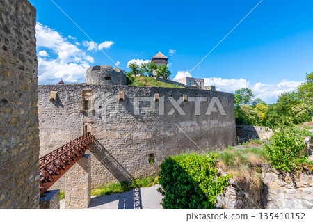 Ancient castle Trencin, Slovakia. Old fort on the hill, big walls and towers. Summer day, dramatic clouds before storm. Ancient castle Trencin, Slovakia. Old fort on the hill, big walls and towers. Summer day, dramatic clouds before storm. 135410152
