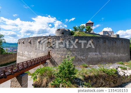 Ancient castle Trencin, Slovakia. Old fort on the hill, big walls and towers. Summer day, dramatic clouds before storm. Ancient castle Trencin, Slovakia. Old fort on the hill, big walls and towers. Summer day, dramatic clouds before storm. 135410153