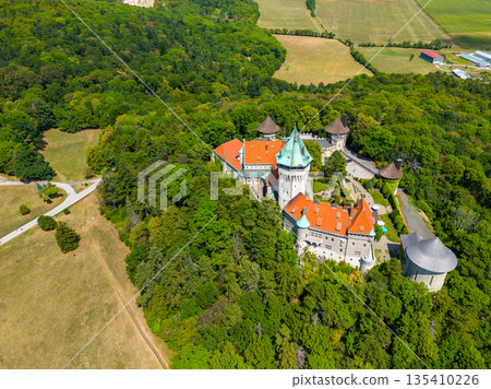 Aerial drone fly near Smolenice castle, Slovakia. Trnava region, Litle Carpathians. Aerial drone fly near Smolenice castle, Slovakia. Trnava region, Litle Carpathians. 135410226