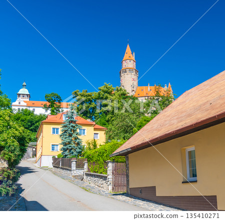 Famous medieval castle Bouzov, Czech Republic. National landmark built in 14 century. Famous tourist destination. Summer weather, blue sky. 135410271