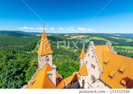 Famous medieval castle Bouzov, Czech Republic. National landmark built in 14 century. Famous tourist destination. Summer weather, blue sky. 135410280