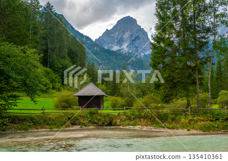 The Krumme Steyr river near the village Hinterstoder and famous lake Schiederweiher. Pure fresh water near Austrian Alps and mountains peaks. Soft colors, peace in nature. 135410361