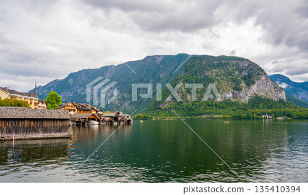 Hallstatt dock at the Hallstatter see lake. Big mountains in background. Hallstatt dock at the Hallstatter see lake. Big mountains in background. 135410394