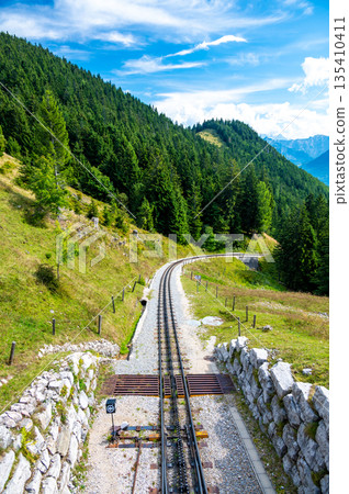 View of Schafberg train and railways. SCHAFBERGBAHN Cog Railway running from St. Wolfgang up the Schafberg, Austria. View of Schafberg train and railways. SCHAFBERGBAHN Cog Railway running from St. Wolfgang up the Schafberg, Austria. 135410411