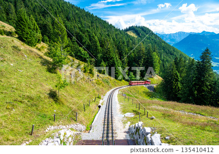 View of Schafberg train and railways. SCHAFBERGBAHN Cog Railway running from St. Wolfgang up the Schafberg, Austria. View of Schafberg train and railways. SCHAFBERGBAHN Cog Railway running from St. Wolfgang up the Schafberg, Austria. 135410412