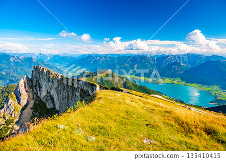 Top of Schafberg hill, Austria. View of big rock on top of mountain. Summer hiking. Top of Schafberg hill, Austria. View of big rock on top of mountain. Summer hiking. 135410415