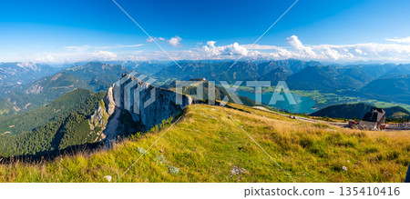 Top of Schafberg hill, Austria. View of big rock on top of mountain. Summer hiking. Top of Schafberg hill, Austria. View of big rock on top of mountain. Summer hiking. 135410416