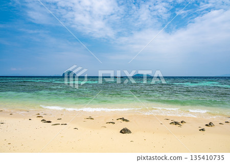View of beautiful tropic beach at Ko Phi Phi islands, Thailand. White sand with green forest, palms and turquoise water. Summer weather, concept of vacation in paradise. 135410735