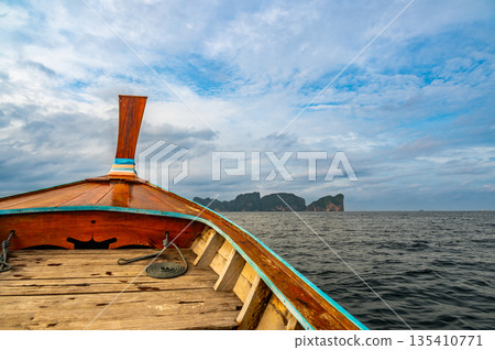 View of limestone rock at Ko Phi Phi islands, Thailand. View from long tailed boat. Exotic and tropic nature, summer paradise. View of limestone rock at Ko Phi Phi islands, Thailand. View from long tailed boat. Exotic and tropic nature, summer paradise. 135410771