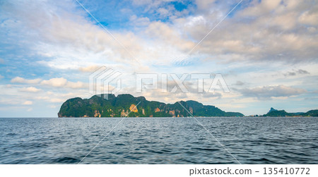 View of limestone rock at Ko Phi Phi islands, Thailand. View from long tailed boat. Exotic and tropic nature, summer paradise. View of limestone rock at Ko Phi Phi islands, Thailand. View from long tailed boat. Exotic and tropic nature, summer paradise. 135410772