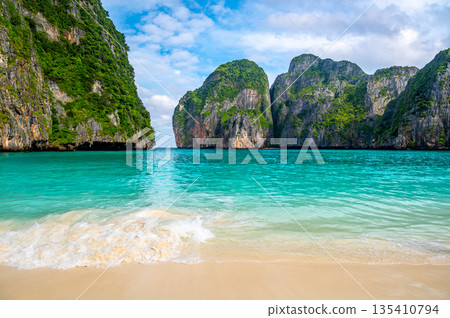 View of famous Maya Bay, Thailand. One of the most popular beach in the world. Ko Phi Phi islands. Beach without people. View of famous Maya Bay, Thailand. One of the most popular beach in the world. Ko Phi Phi islands. Beach without people. 135410794