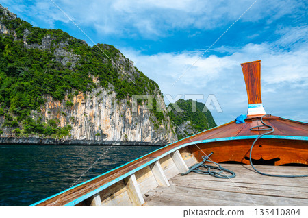 View of limestone rock at Ko Phi Phi islands, Thailand. View from long tailed boat. Exotic and tropic nature, summer paradise. 135410804