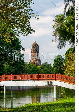Ruins of ancient city and temples Ayutthaya, Thailand. Old kingdom of Siam. Summer day with blue sky. Famous tourist destination, spiritual place near Bangkok. 135410818