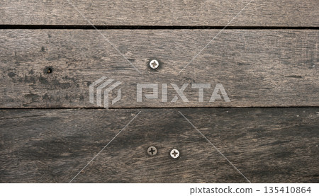 Texture of old wood with screw inside. Dark brown color. 135410864