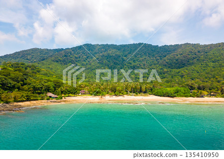 Aerial drone view of tropical beach at Ko Lanta island, Thailand. Coastline view of famous target destination. Pure turquoise water and white sand. 135410950