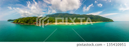 Aerial drone view of tropical beach at Ko Lanta island, Thailand. Coastline view of famous target destination. Pure turquoise water and white sand. Aerial drone view of tropical beach at Ko Lanta island, Thailand. Coastline view of famous target destination. Pure turquoise water and white sand. 135410951