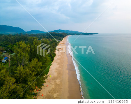 Aerial drone view of tropical beach at Ko Lanta island, Thailand. Coastline view of famous target destination. Pure turquoise water and white sand. 135410955