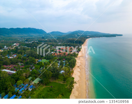 Aerial drone view of tropical beach at Ko Lanta island, Thailand. Coastline view of famous target destination. Pure turquoise water and white sand. 135410956