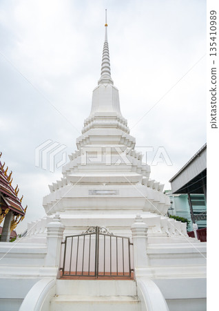 Wat Rakhang Kositaram buddhist temple at Bangkok, Thailand. White temple with pagoda, religion building. 135410989