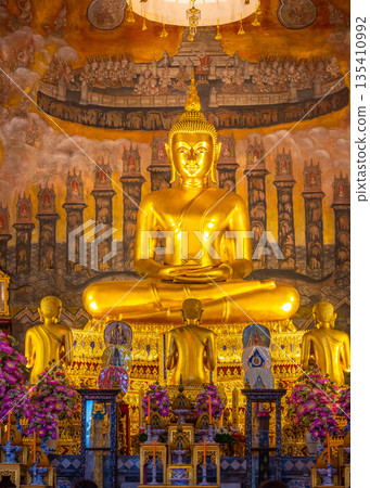 Golden statue of Buddha in buddhist temple, Bangkok city, Thailand. 135410992